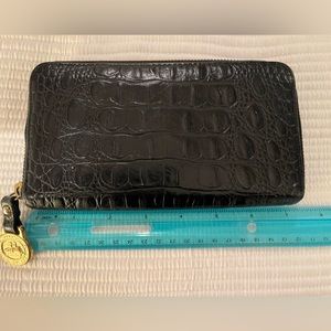 Brahmin black leather zip wallet.
